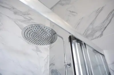 a shower with a shower head in a bathroom at GuestReady - Charming Gaia apartment in Vila Nova de Gaia