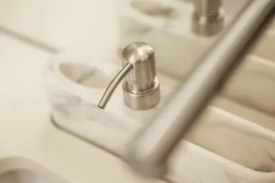 a bathroom sink with a silver faucet at Modern Flat with balcony on Rua das Flores - 2nd in Porto