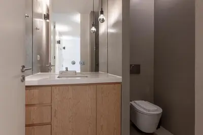 a bathroom with a sink and a toilet at Modern Flat with balcony on Rua das Flores - 3rd in Porto