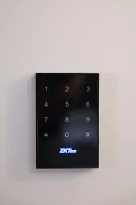 a remote control on a white wall at Modern Flat with balcony on Rua das Flores - 5th in Porto