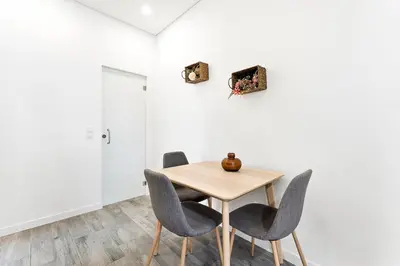 a dining room with a wooden table and chairs at GuestReady - Douro D'or Apartments in Vila Nova de Gaia