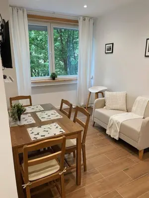 a living room with a table and a couch at Bandeira Place in Porto