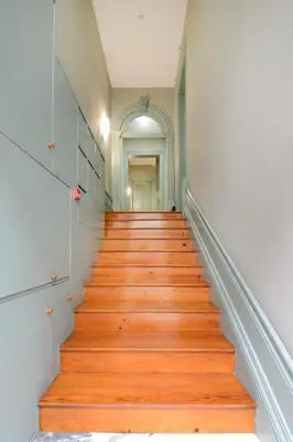 a staircase in a building with wooden floors at Bright Cedofeita Flat with Balcony in Porto