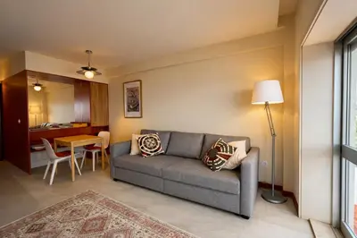 a living room with a couch and a table at Good View Studio in Porto