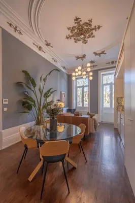 a dining room with a table and chairs at Historic Porto Stay, Classic Details, City Life in Porto