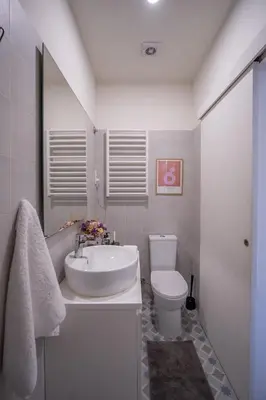 a white bathroom with a sink and a toilet at Historic Porto Stay, Classic Details, City Life in Porto