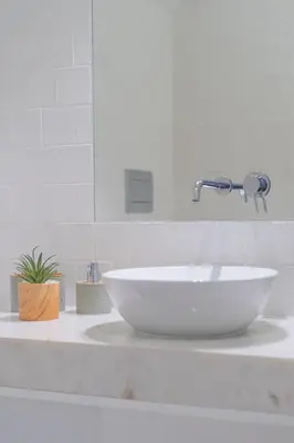 a shower with a glass door in a bathroom at Upper Story 1BR AC and Workspace in Porto