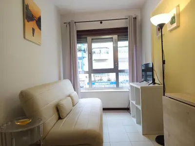 a bedroom with a large bed and a window at Glimpses of Australia in Porto