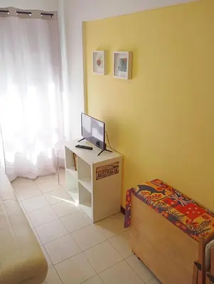 a kitchen with wooden cabinets and a white refrigerator at Glimpses of Australia in Porto