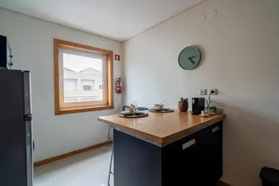 a living room with a bed and a couch at Green Studio near Metro, Cedofeita, Porto in Porto