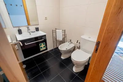 a bathroom with a toilet and a sink at Green Studio near Metro, Cedofeita, Porto in Porto