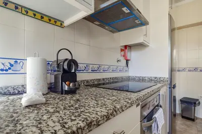 a kitchen with a counter top and a sink at 2 Bdr Guadiana House Garden Metro Station 2min in Porto