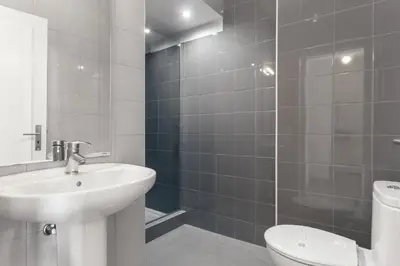a bathroom with a sink and a toilet and a shower at Belly Angel - Porto Historic Center in Porto