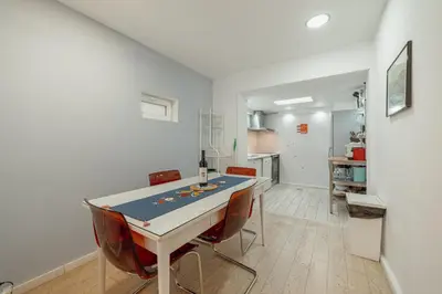 a kitchen and dining room with a table and chairs at Porto Window House by Vacationy in Bandeira