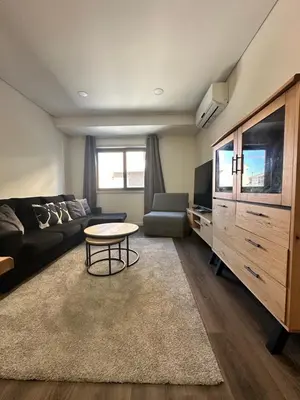 a living room with a couch and a table at SP Douro Apartment in Vila Nova de Gaia