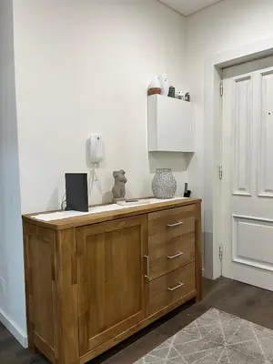 a bedroom with a large bed and a rug at SP Douro Apartment in Vila Nova de Gaia
