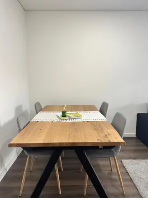 a kitchen with a wooden cabinet with a laptop on it at SP Douro Apartment in Vila Nova de Gaia