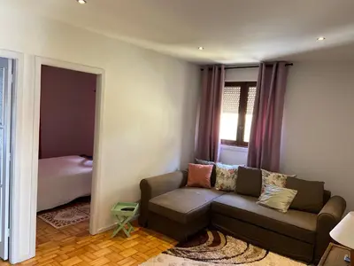 a living room with a couch and a bed at House T3 in Vila Nova de Gaia