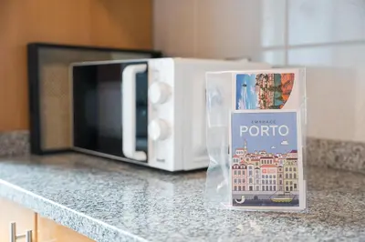 a packet of potato sitting next to a microwave at GuestReady - Cosy Porto retreat in Porto