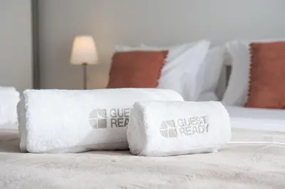 a couple of towels sitting on a bed at GuestReady - Cosy Porto retreat in Porto