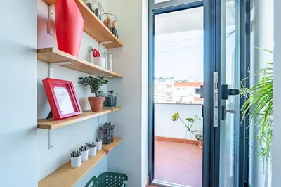 a dining room with a wooden table and chairs at Charming retreat near Boavista with elevator in Porto