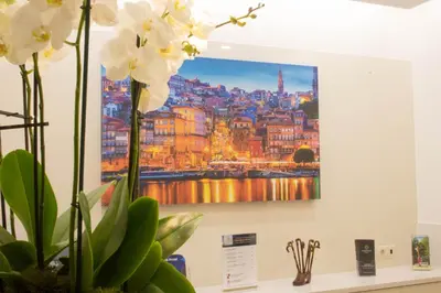a picture of the city of berlin on a wall at Lusitana Hotel in Porto