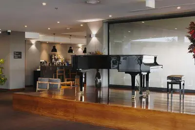 a piano in a room with a bar at Timbre Heroismo in Porto