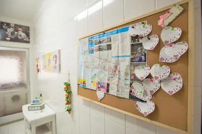 a bulletin board with hearts hanging on a wall at Sta. Catarina Home in Porto