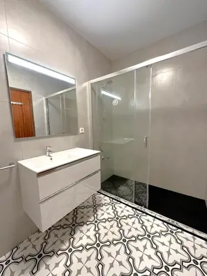 a bathroom with a sink and a shower at Sta. Catarina Home in Porto