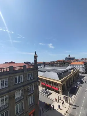 an overhead view of a city street with buildings at Baixa24 - Bolhão Apt with Sunset Rooftop in Porto
