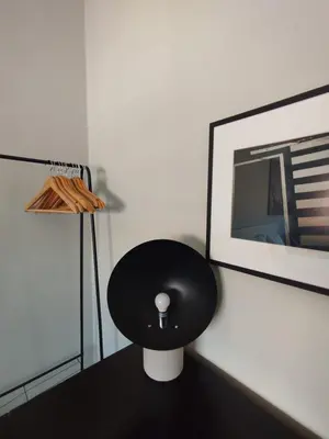 a black stool sitting on a table in a room at Baixa24 - Bolhão Apt with Sunset Rooftop in Porto