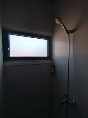 a shower in a bathroom with a window at Baixa24 - Bolhão Apt with Sunset Rooftop in Porto