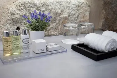 a table with towels and other products on it at Belomont52 Guest House in Porto