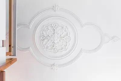 a white ceiling with a design on a wall at Studio 77 in Porto