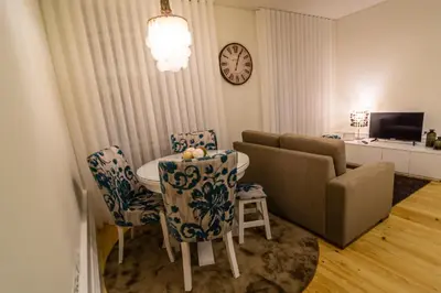 a living room with a couch and a table and chairs at Casa d'Alma by Oporto Soul in Porto