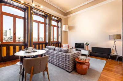 a living room with a couch and a table at YOUROPO - Bolhao in Porto