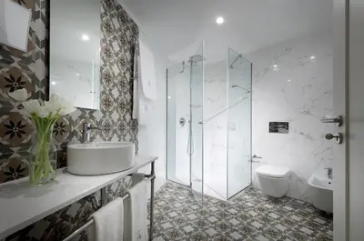 a bathroom with a shower and a sink and a toilet at Eurostars Porto Douro in Porto