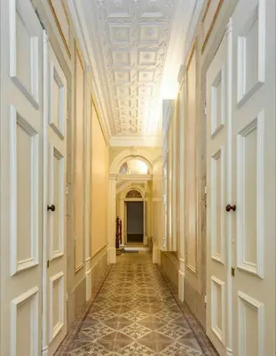 an empty hallway in a building with a ceiling at ML Apartments Story in Porto