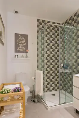 a bathroom with a shower and a toilet at Oporto Golden View Ribeira in Porto