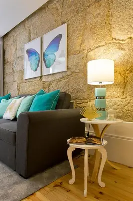 a living room with a couch and a table at Oporto Golden View Ribeira in Porto