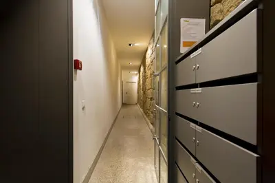 a corridor of a hallway with a hallway at Oporto Golden View Ribeira in Porto