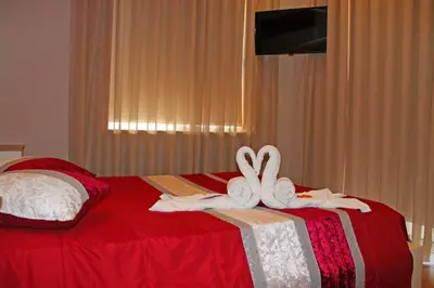 a bedroom with a bed with towels on it at Monte Carlo Love Porto in Porto