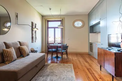 a living room with a couch and a table at Oporto Maison Alves da Veiga in Porto