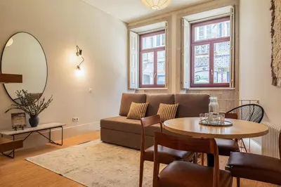 a living room with a couch and a table at Oporto Maison Alves da Veiga in Porto