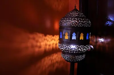 a street light in front of a wall at Porto Riad - Guest House in Porto