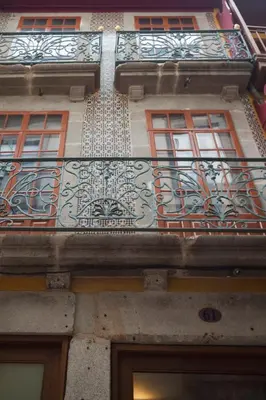 a building with a balcony on the side of it at Go2Oporto - Historical Center in Porto