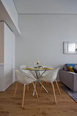 a dining room with a table and two chairs at OHH -Porto 4 you- Deluxe Apartment With Free Parking in Porto
