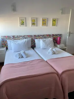 two beds sitting next to each other in a room at Apartamento Vintage 2 in Porto