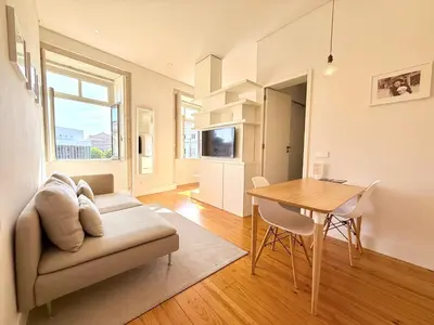 a living room with a couch and a table at Porto Cinema Apartments in Porto