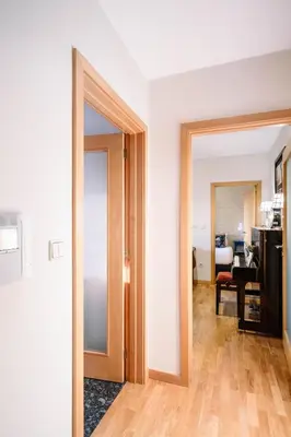 an open door to a room with a living room at BBA Apartments Boavista - Casa da Música with free parking in Porto